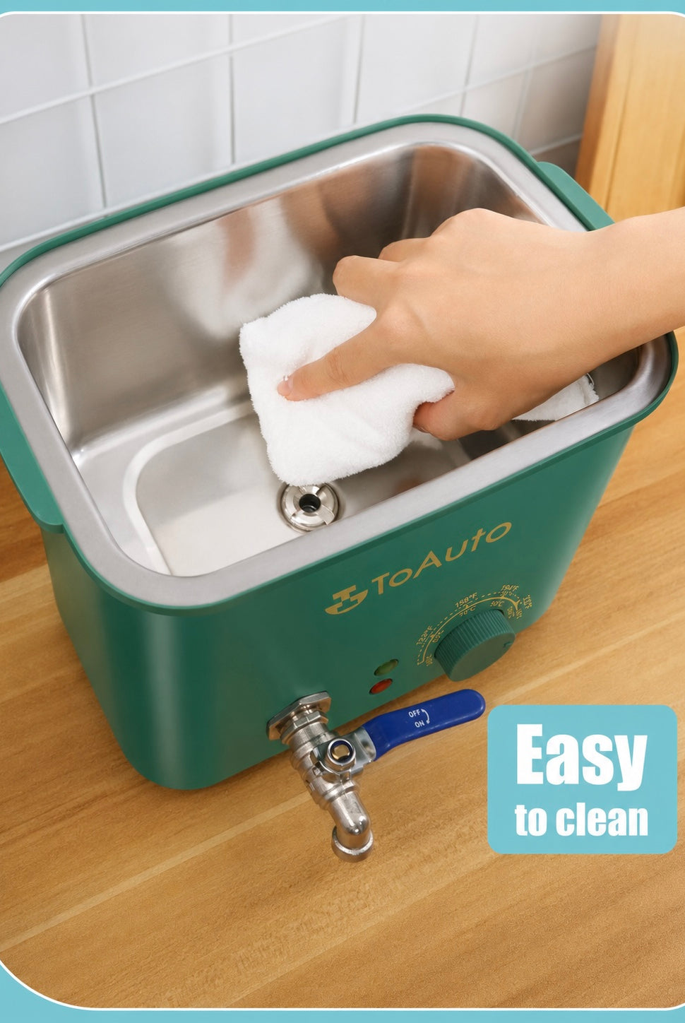 Hand cleaning a the inside of a 4 litre wax melter with a white cloth, labeled 'Easy to clean'.