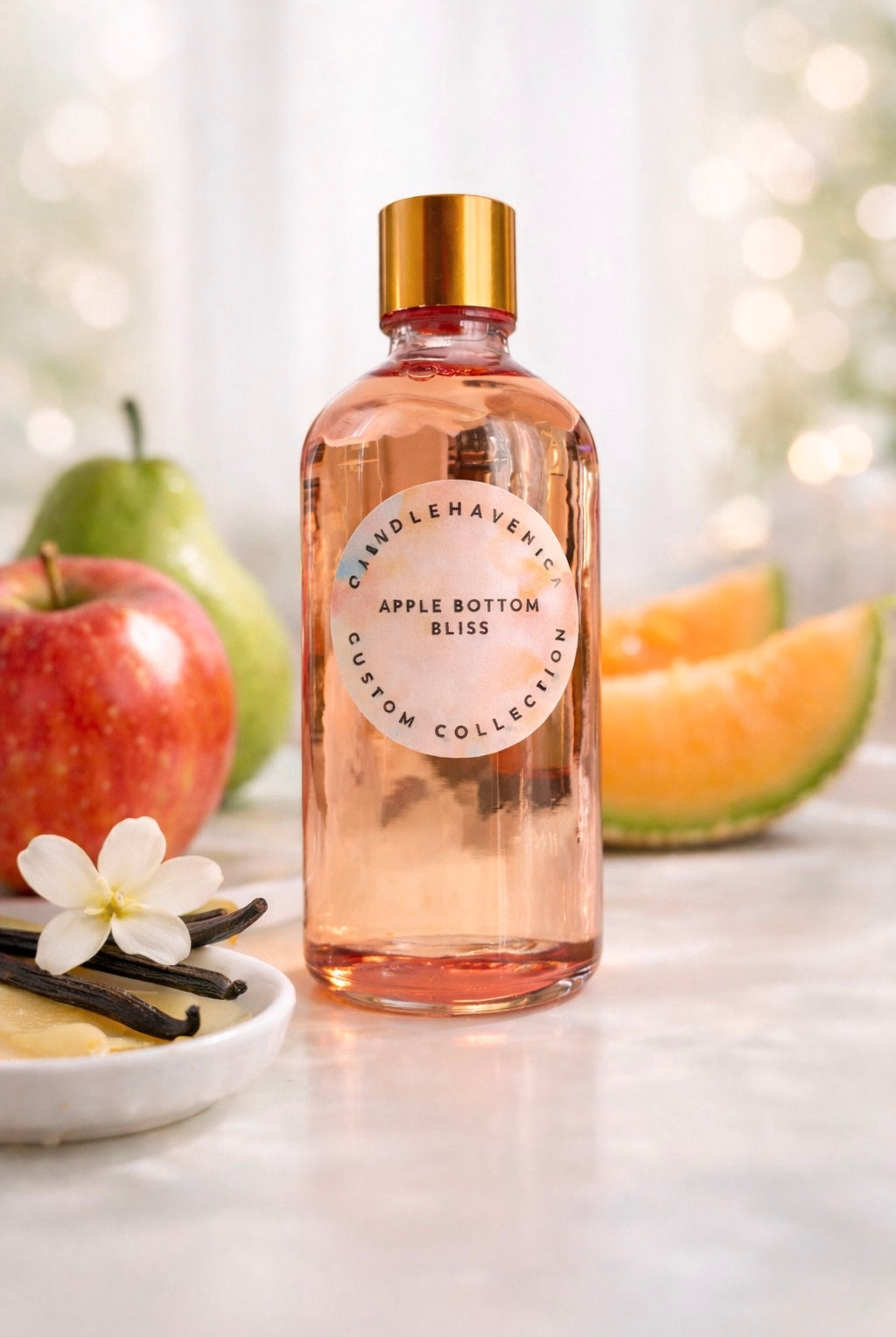 Candlehaven bottle of Apple Bottom Bliss fragrance oil with apples, pears and vanilla on a light background