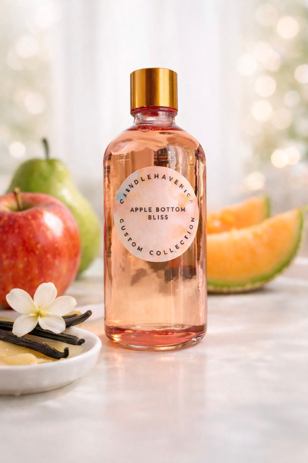 Candlehaven bottle of Apple Bottom Bliss fragrance oil with apples, pears and vanilla on a light background