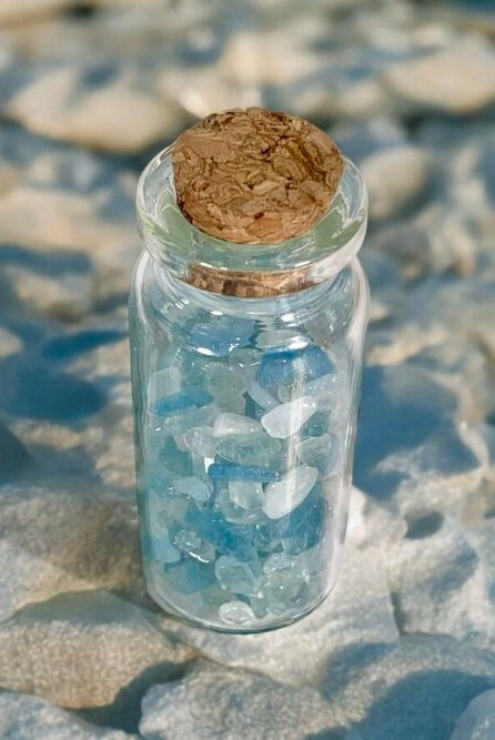Aquamarine mini chips in a bottle used in candle making