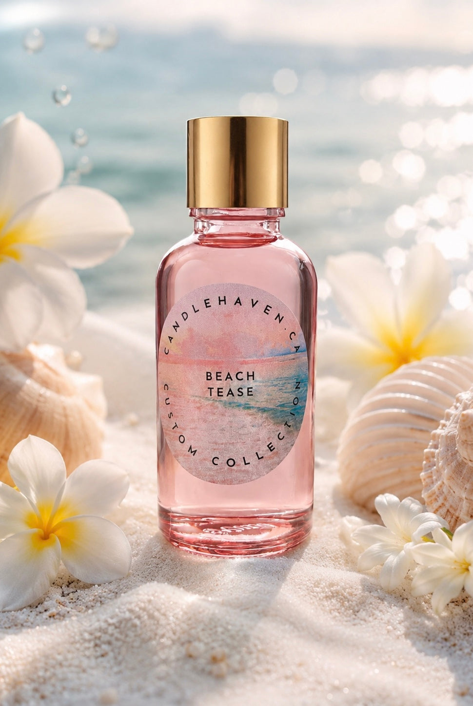 Pink bottle of Candle Haven Beach Tease fragrance oil for candle making on sand with flowers and shells
