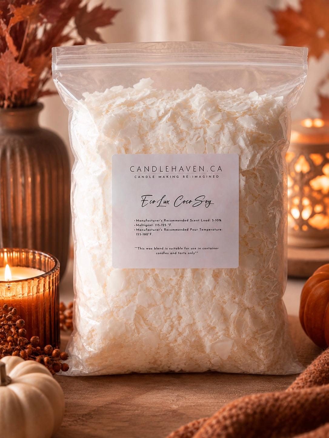 A clear plastic bag filled with white wax sits on a wooden surface, labeled Candlehaven Co. EcoLux Coco Soy Wax