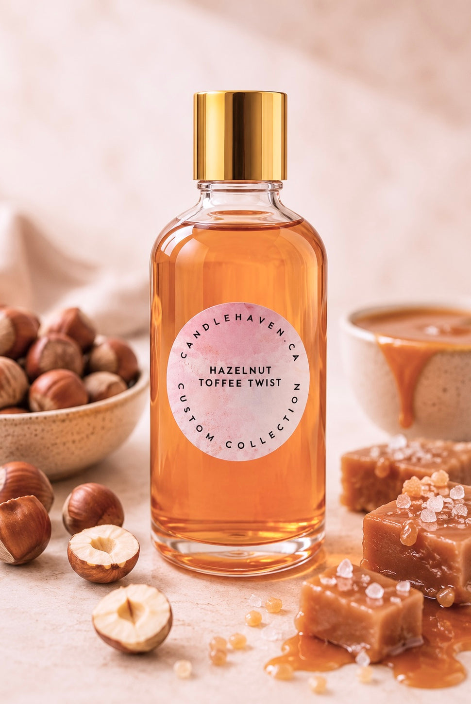 Bottle of Candlehaven hazelnut toffee twist fragrance oil for candle making with hazelnuts and toffee on a light background