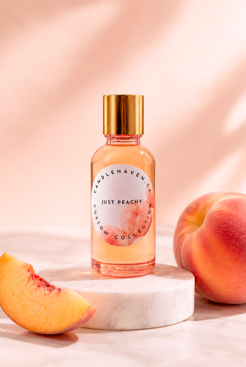 Fragrance oil bottle labeled 'Just Peachy' by Candlehaven.ca with peaches on a light background