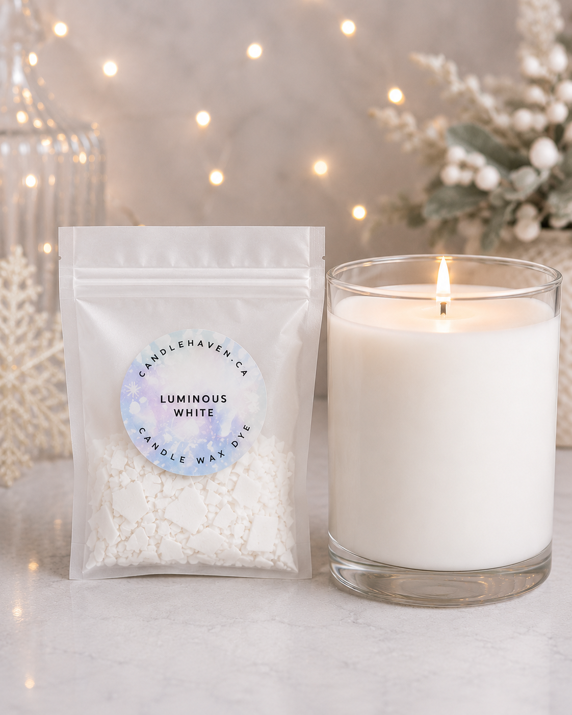 White wax dye chips used in candle making with a white candle beside on a light background