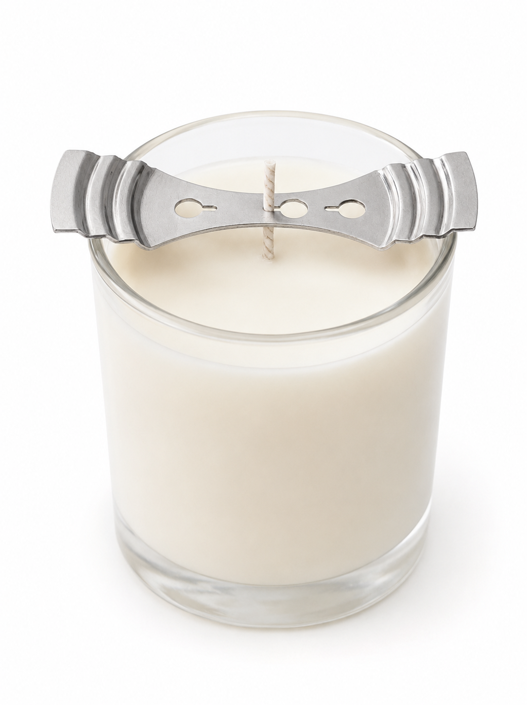 Glass candle with a metal wick setter on a white background