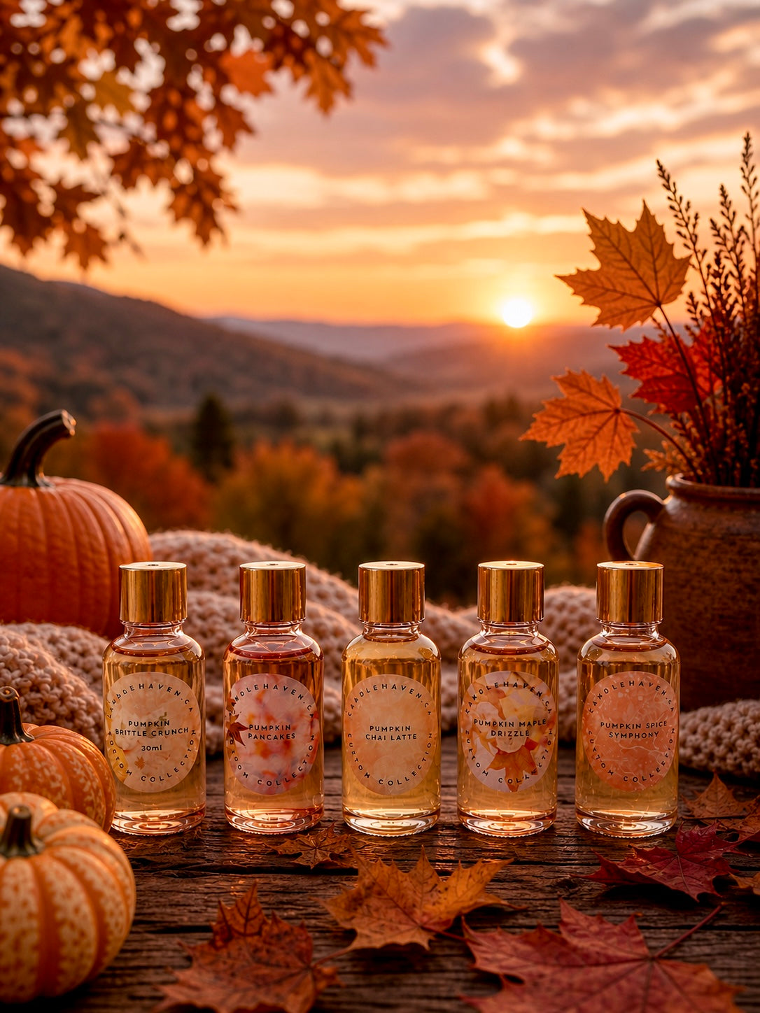 Five bottles of pumpkin style fragrance oils for candle making on a wooden surface with pumpkins and autumn leaves, set against a scenic fall sunset.