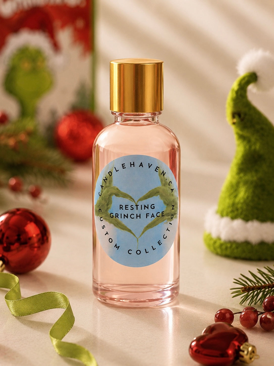 A bottle of Resting Grinch Face fragrance oil by Candlehaven.ca used in candle making with a dr Suess inspired background.