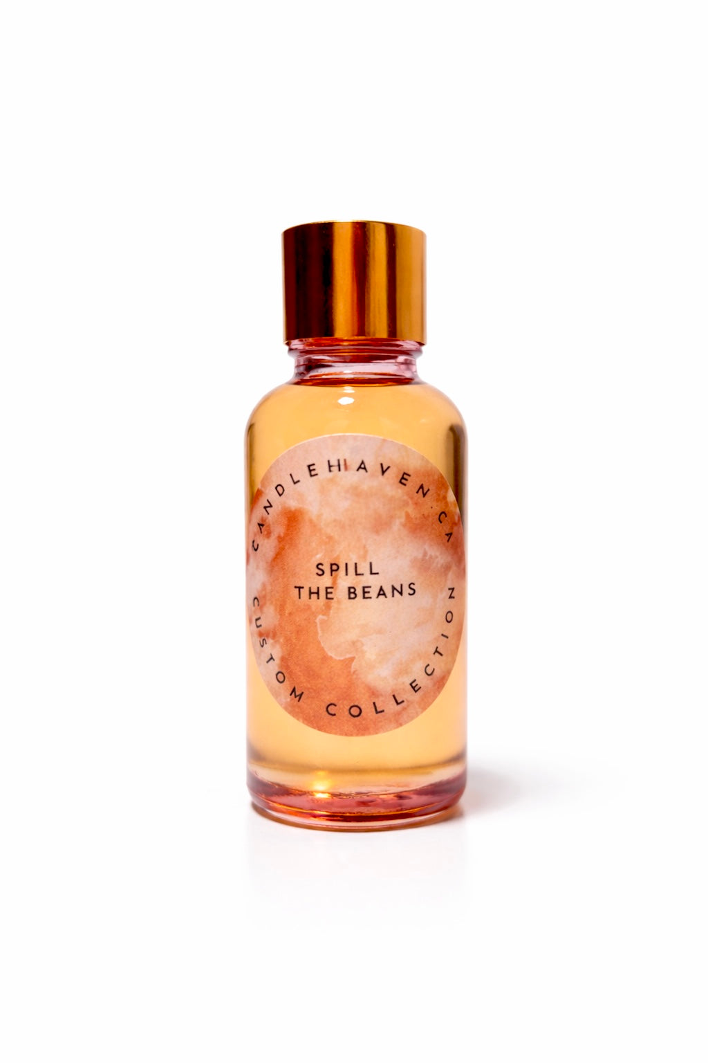 Perfume bottle labeled 'Spill the Beans' by Candle Haven on a white background