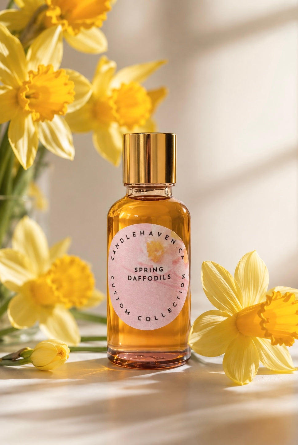 Spring Daffodils fragrance oil bottle by candlehaven.ca used in candle making on a light background with daffodils.