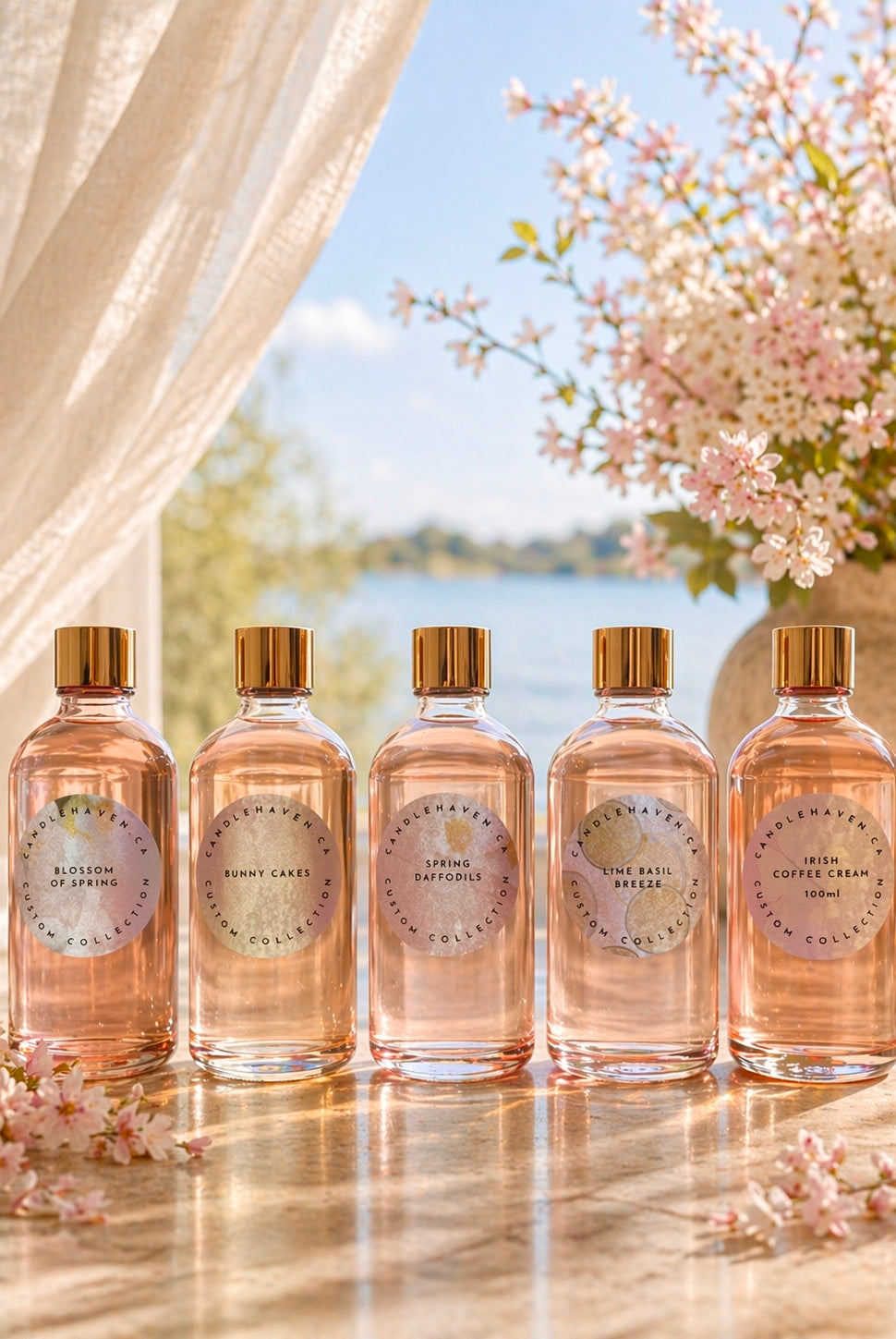 Five bottles of Candlehaven candle fragrance oils on a table with a scenic background