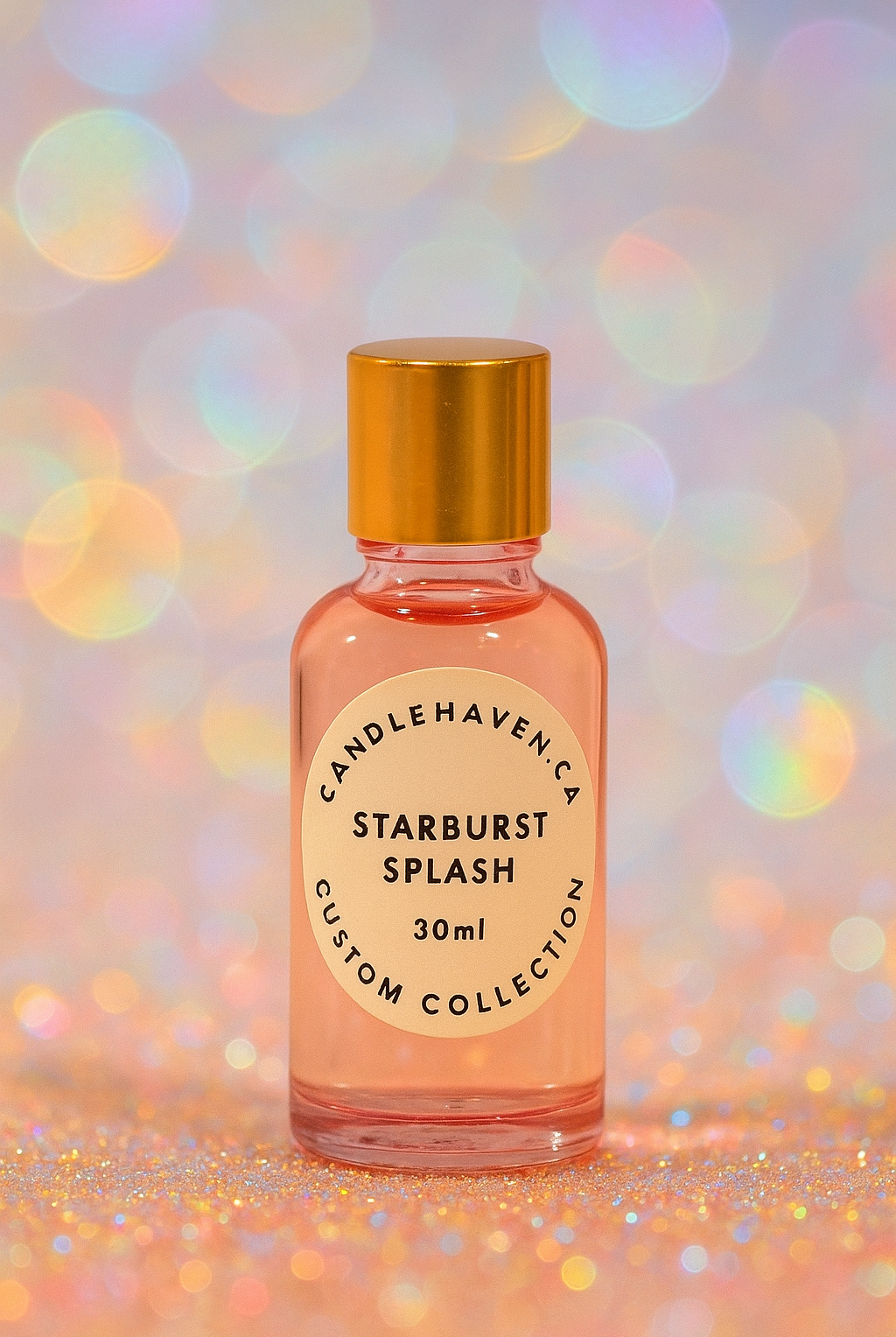 Bottle of 'Starburst Splash' fragrance oil with a gold cap on a colorful, blurred background