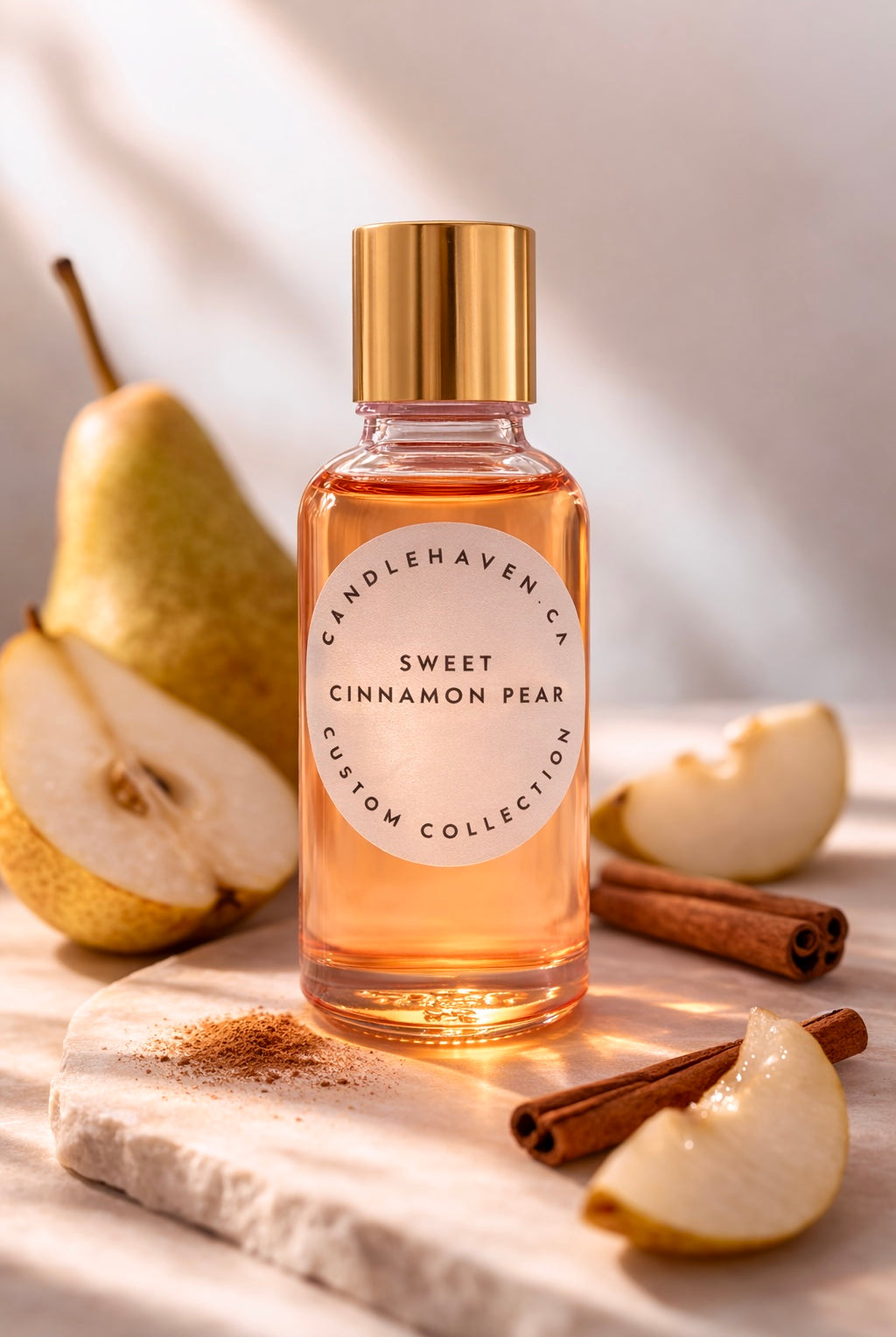 Bottle of 'Sweet Cinnamon Pear' candle fragrance oil with pears and cinnamon sticks on a wooden surface