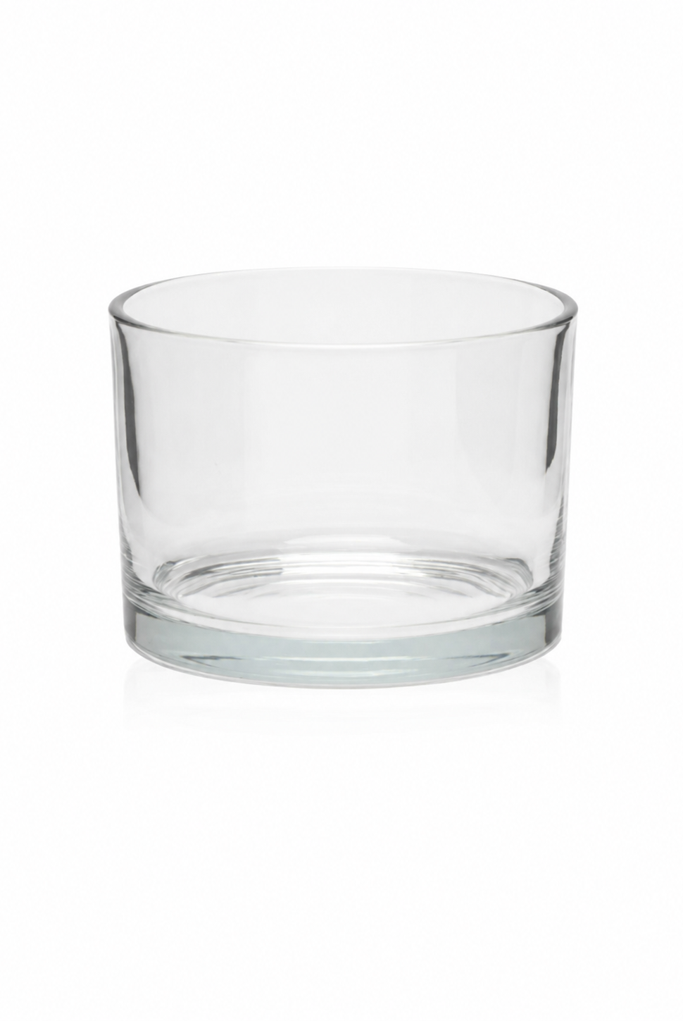 Clear glass candle vessel on a white background