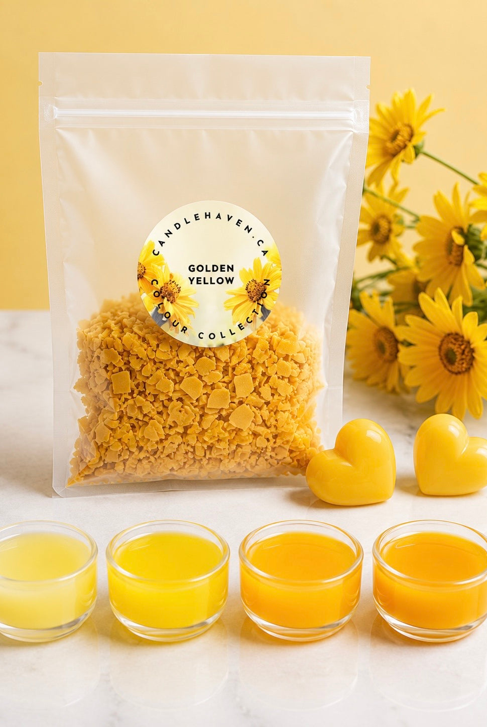 Packaged wax dye chips for candle making labeled 'Golden Yellow' with yellow flowers and small containers of yellow wax on a light background.