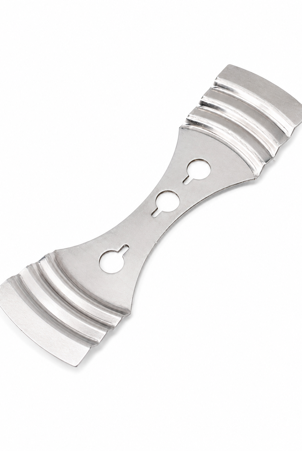 Metal wick setter used to secure candles on a white background