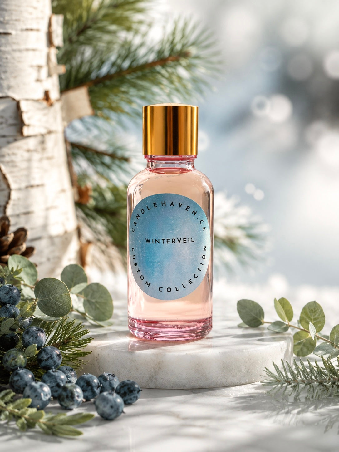 Fragrance oil bottle by candlehaven with gold cap on a marble surface surrounded by greenery