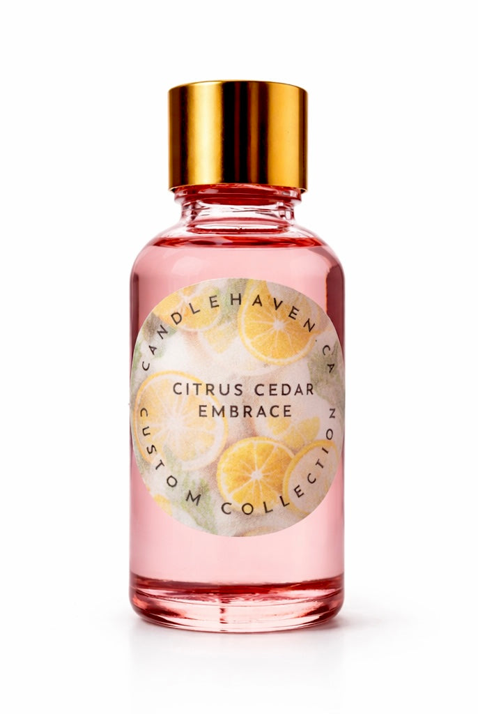 Pink bottle containing candle fragrance oil with gold cap labeled 'Citrus Cedar Embrace' by candlehaven candle supplier on a white background