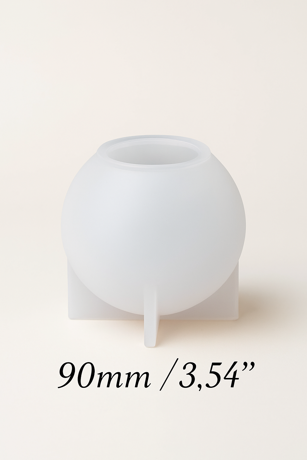 White spherical silicone mold on a beige background with measurement text