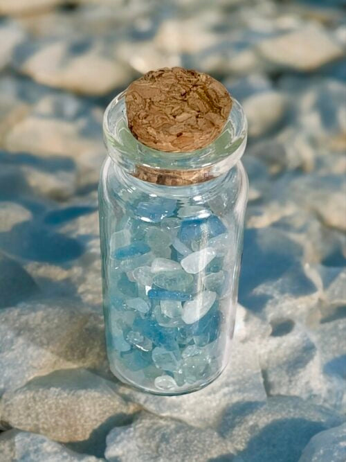 Aquamarine mini chips in a bottle used in candle making 