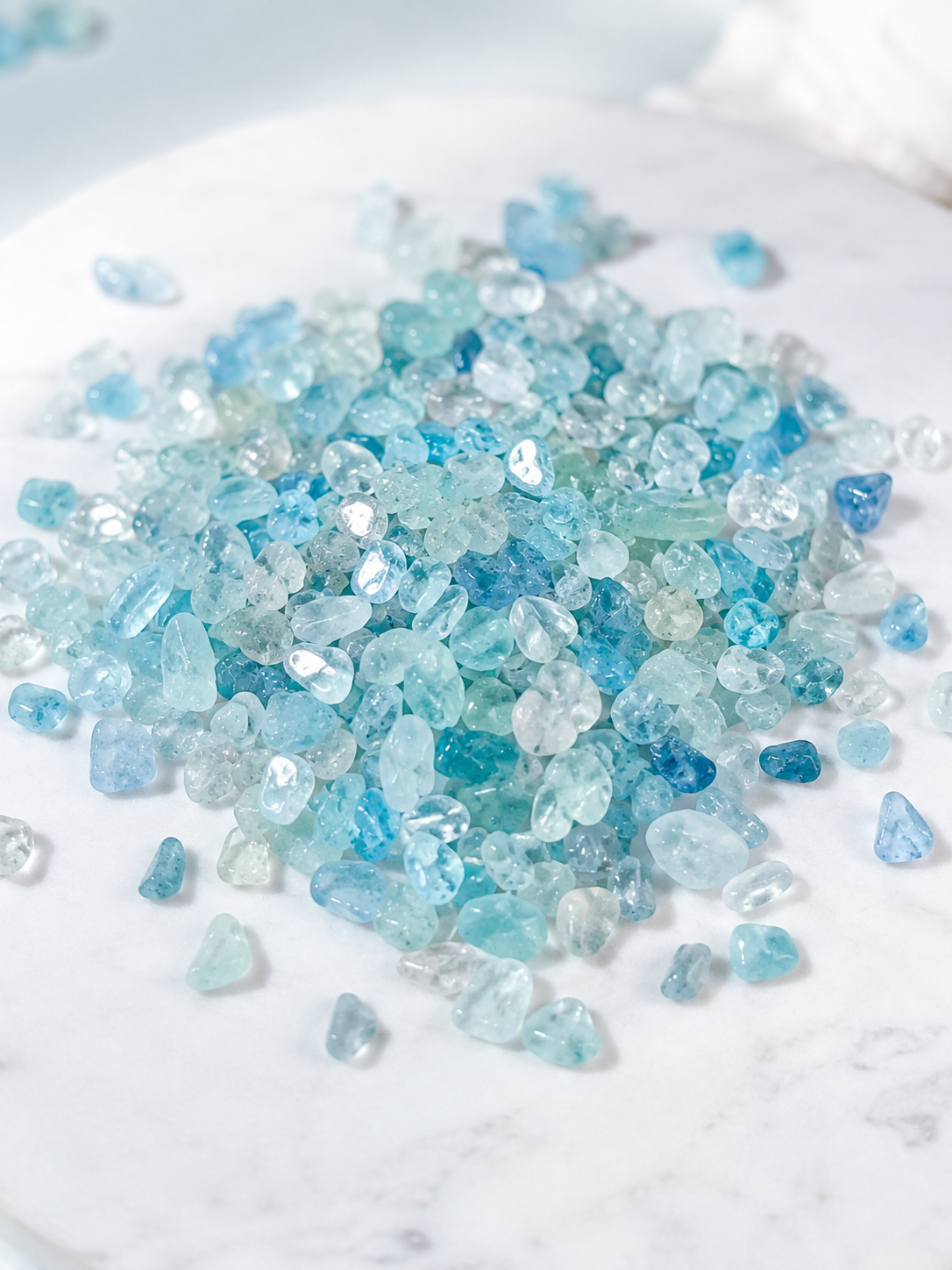Aquamarine mini chips laid on a light background 