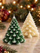 Two Christmas tree wax molds in a Christmas setting