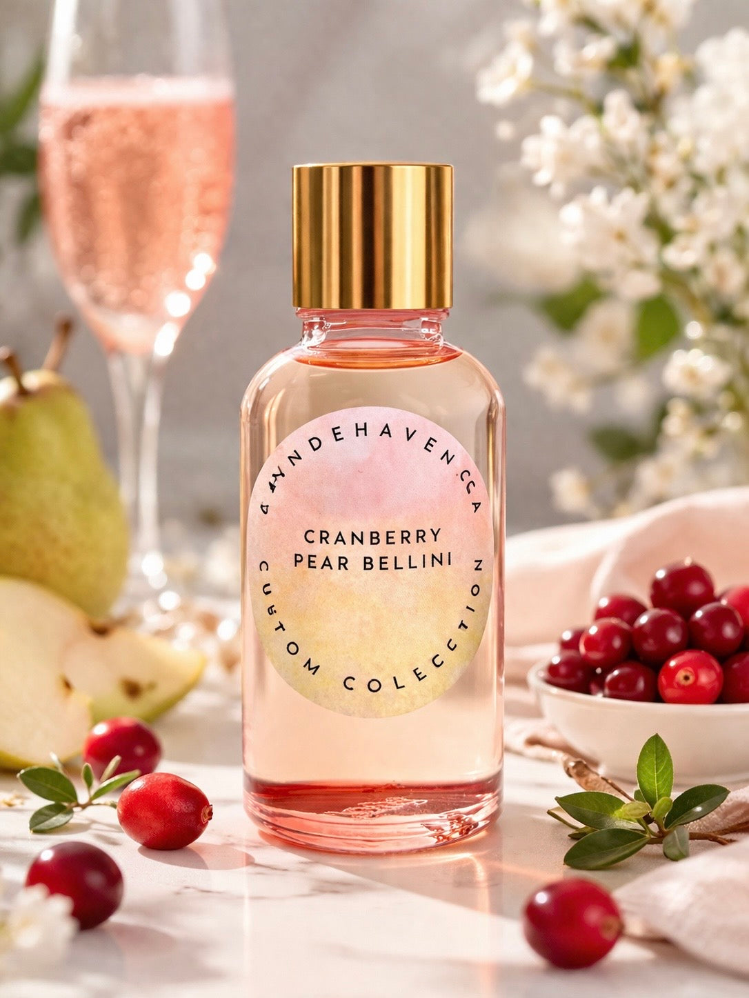 Bottle of Cranberry Pear Bellini fragrance oil by Candlhaven with fruits and a glass in the background