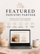Laptop displaying a 'Featured Industry Partner' banner with candle-themed design on a desk.
