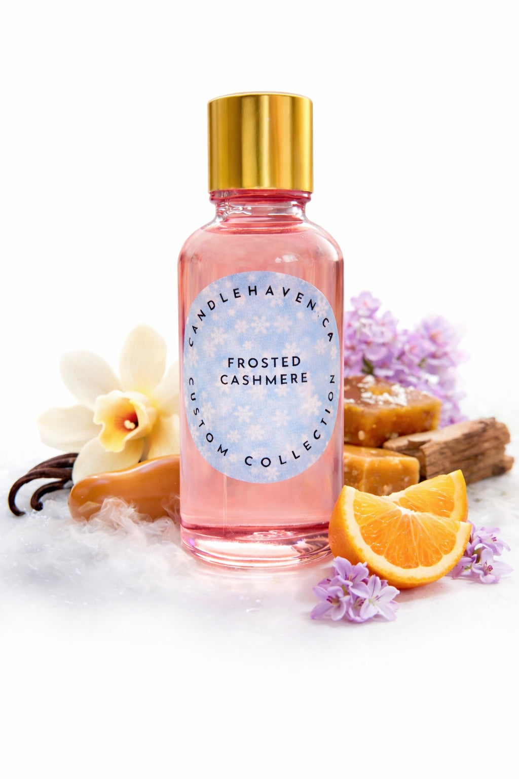 Bottle of 'Frosted Cashmere' with decorative elements on a white background