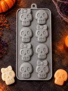 Halloween Skulls Silicone Mold for candle making on a halloween themed background