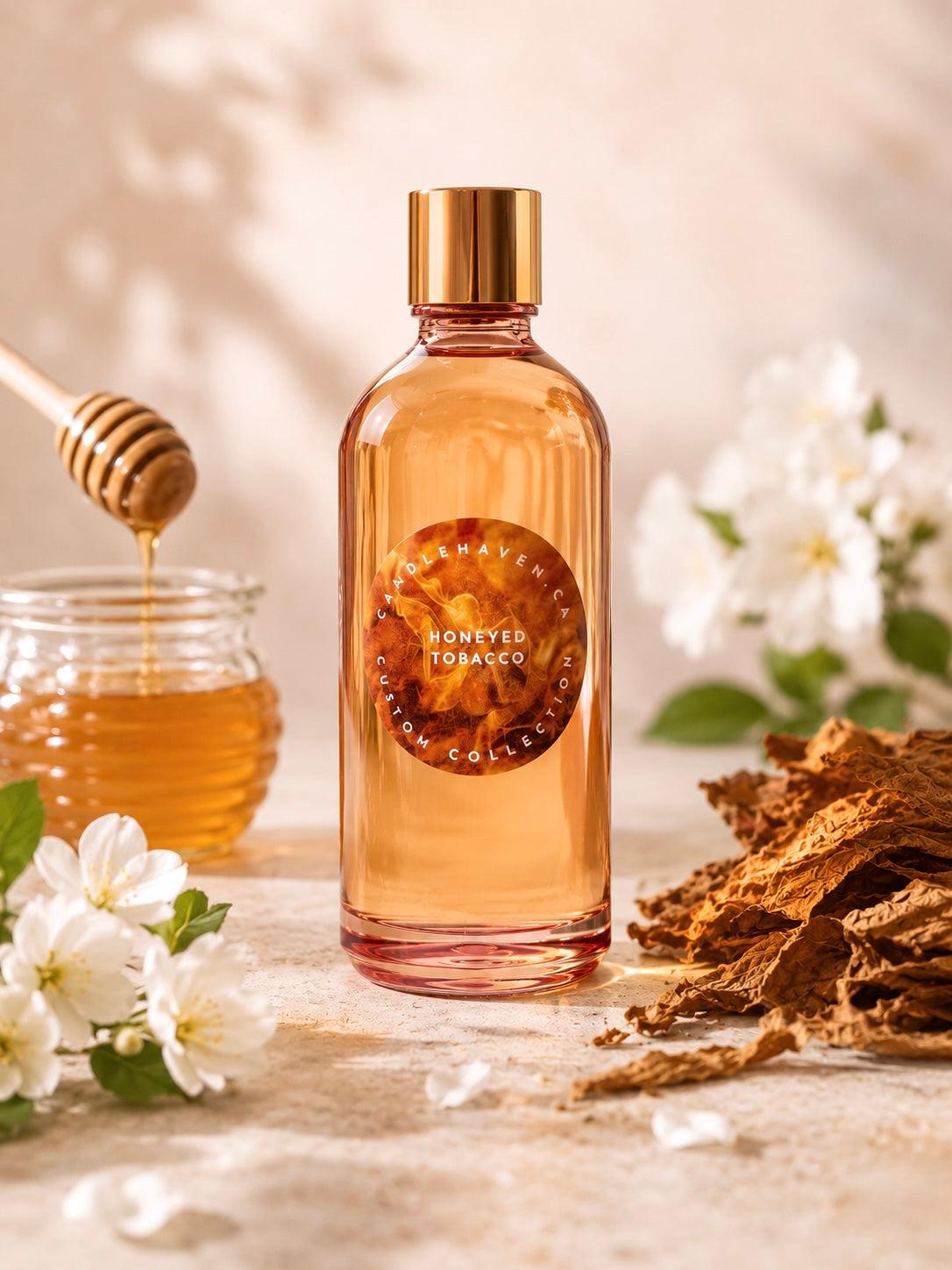 Honeyed Tobacco fragrance oil bottle with honey jar and flowers on a wooden surface