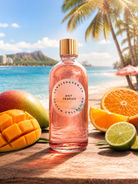 Candlehaven Hot Tropics candle fragrance oil bottle with tropical fruits on a beach setting