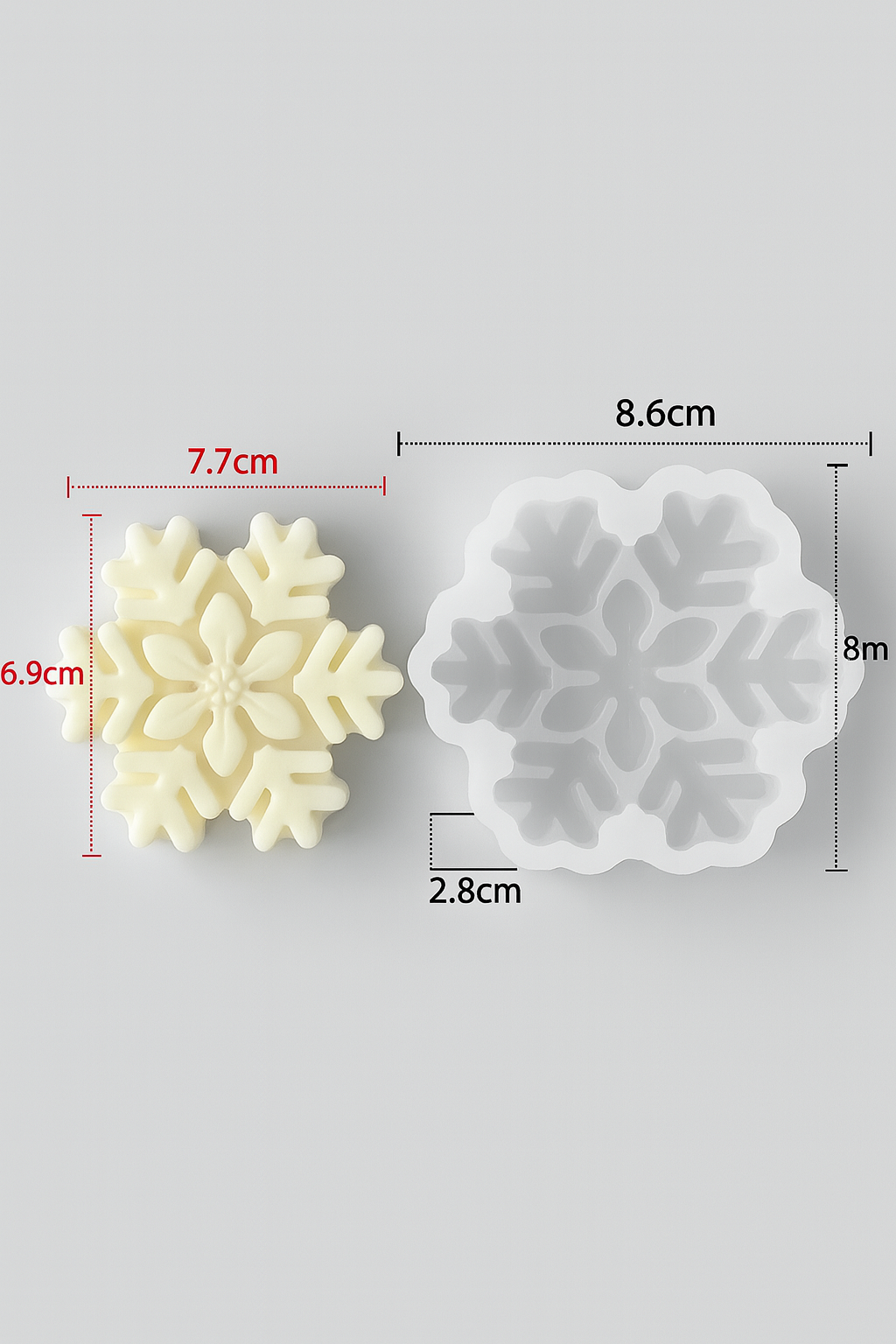 Snowflake-shaped cookie cutter with measurements on a gray background