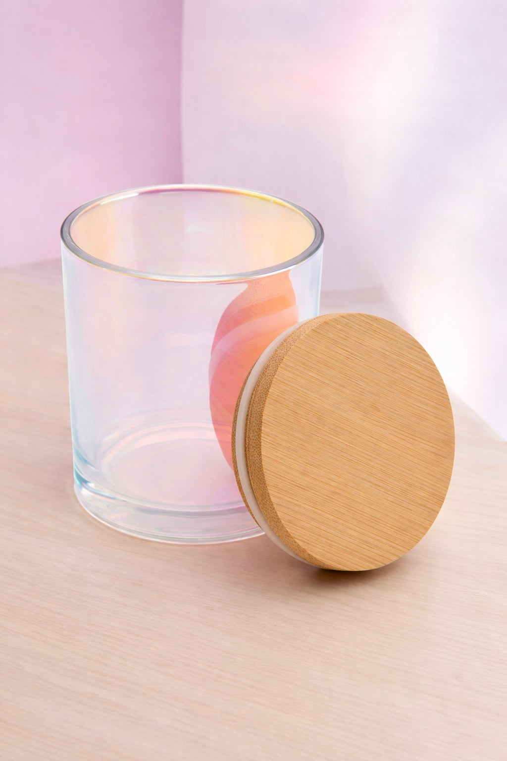 Iridescent Candle Vessel with Bamboo Lid On a soft pink minimalist background 