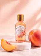Fragrance oil bottle labeled 'Just Peachy' by Candlehaven.ca with peaches on a light background