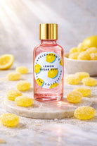 Bottle of Candlehaven.ca Lemon Sugar Rush candle fragrance oil with lemon gum drops on a marble surface