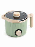 Green electric wax melter with beige handle and lid on a white background