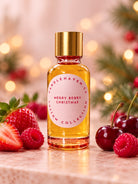 A bottle of Candlehaven.ca’s Merry Berry Christmas fragrance oil pictured with strawberries, cherries and raspberries and blurred Christmas lights in the background. 