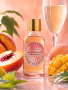 Pink bottle of peach mango prosecco fragrance oil by candlehaven on a light coloured background 