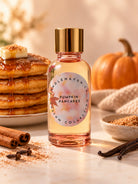 A bottle of Candlehaven.ca’s Pumpkin Pancakes fragrance oil for candle making amidst pancakes and fall decor 