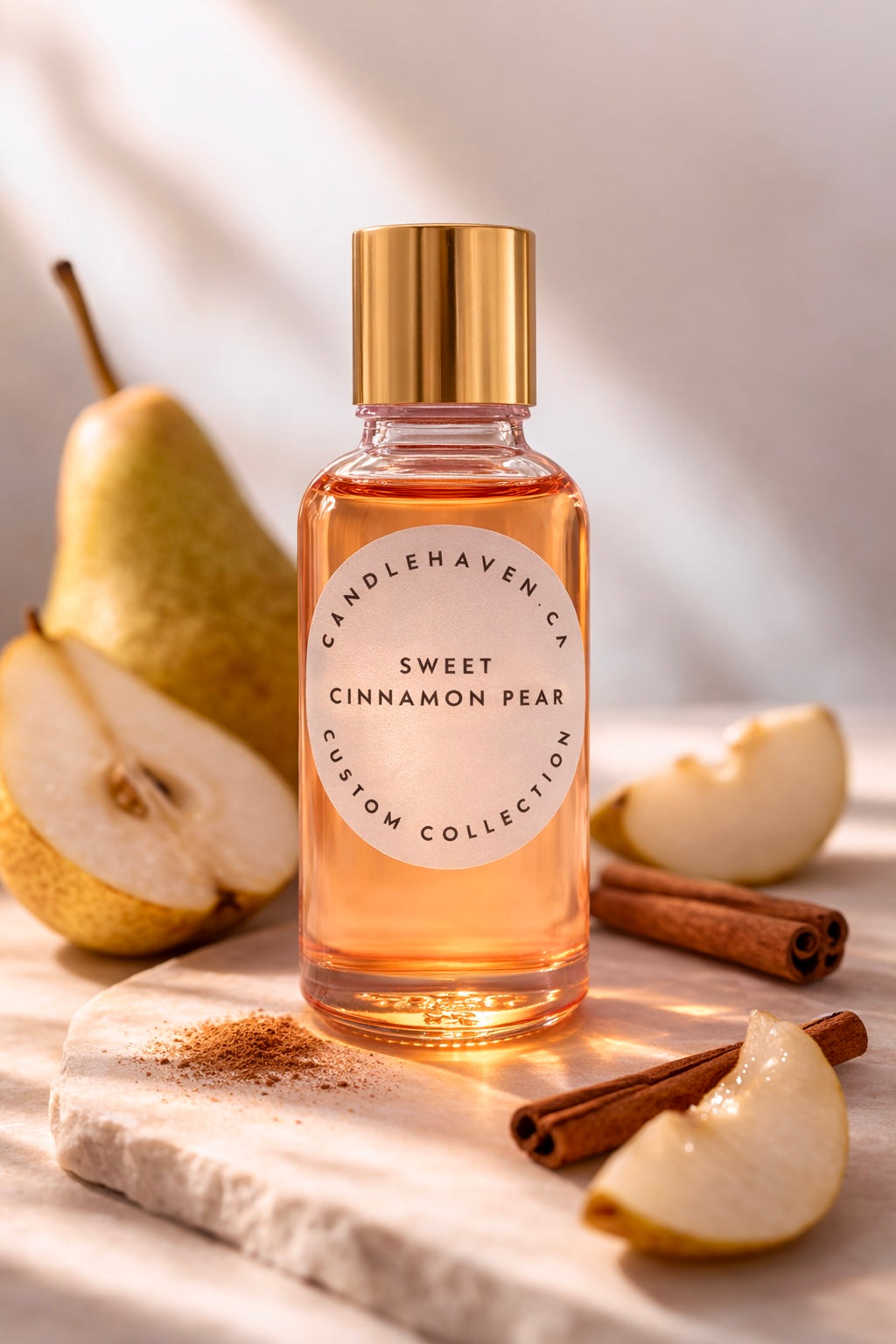 Bottle of 'Sweet Cinnamon Pear' candle fragrance oil with pears and cinnamon sticks on a wooden surface