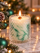 Lit candle in a Franci bessel with a cross wick made of wood lit inside in a Christmas background
