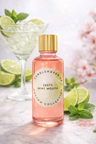 Bottle of 'Zesty Mint Mojito' from Candlehaven on a marble surface with limes and mint leaves.