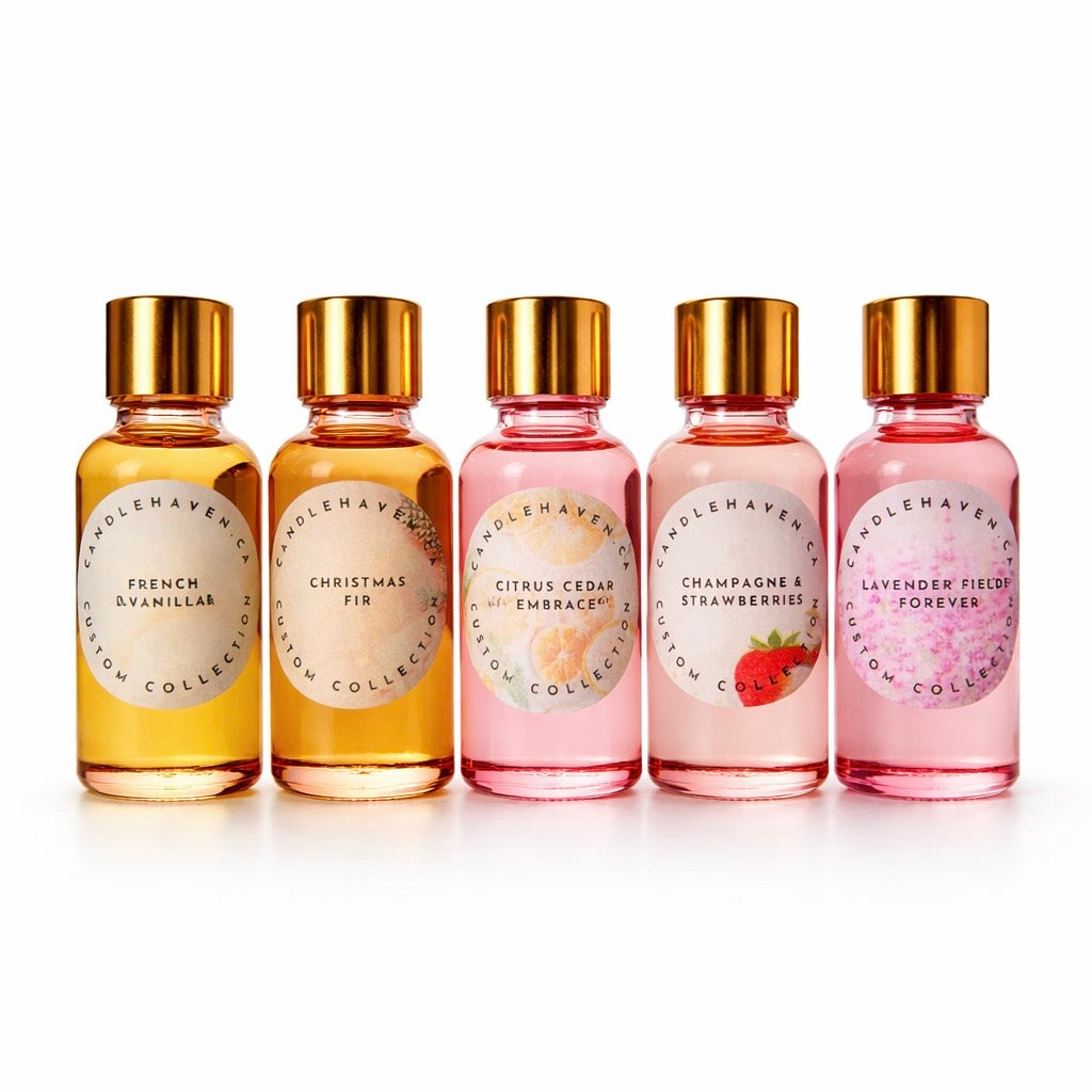 Five bottles of Candlehaven fragrance oils for candle making with gold caps on a white background