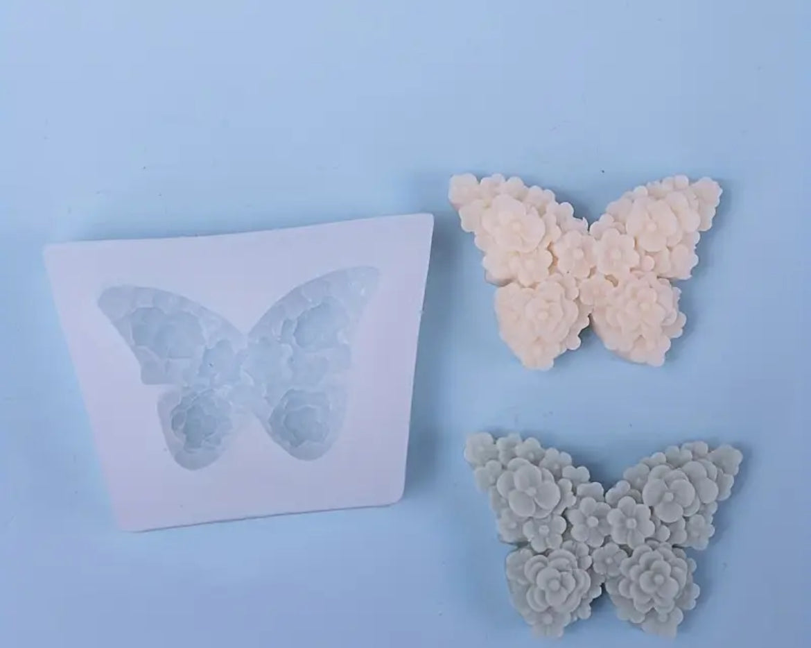 Butterfly-shaped silicone molds on a light blue background | silsicone reusable mold canada