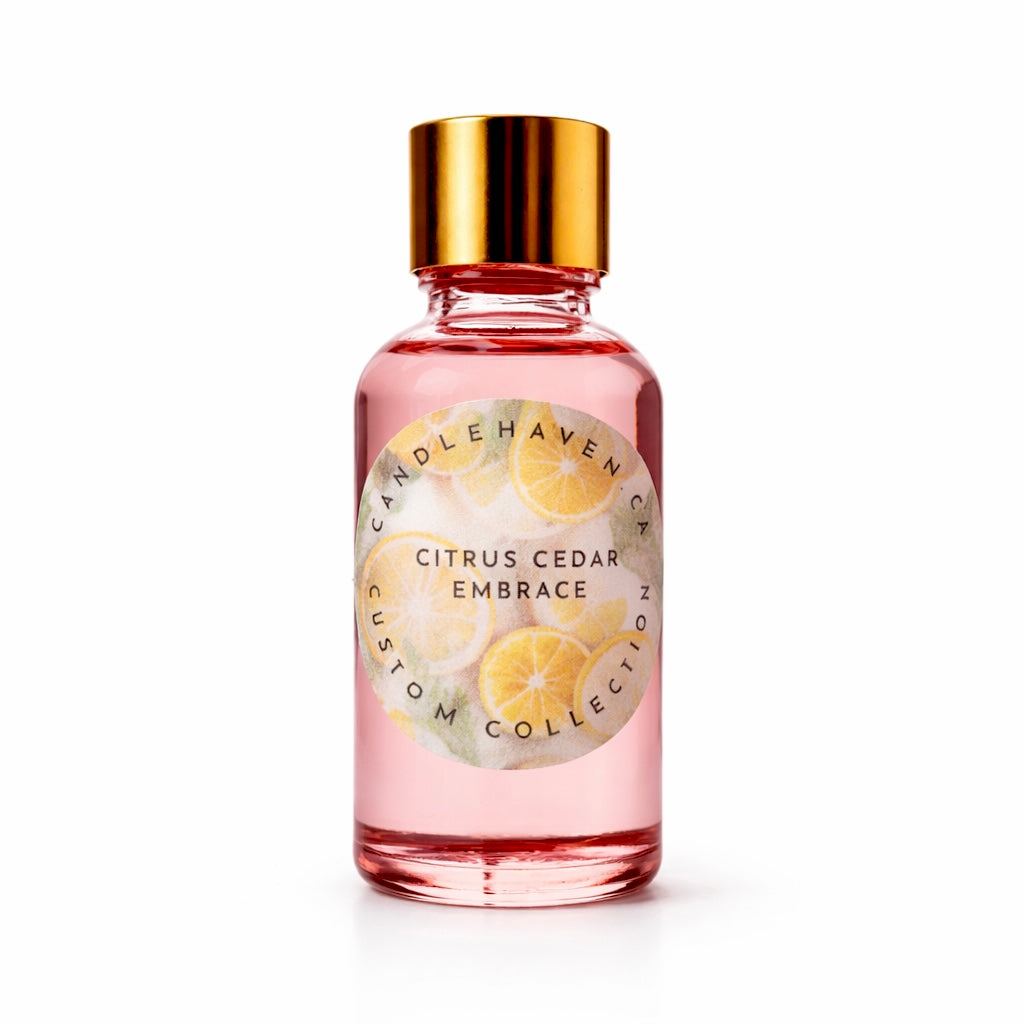 Pink bottle containing candle fragrance oil with gold cap labeled 'Citrus Cedar Embrace' by candlehaven candle supplier on a white background