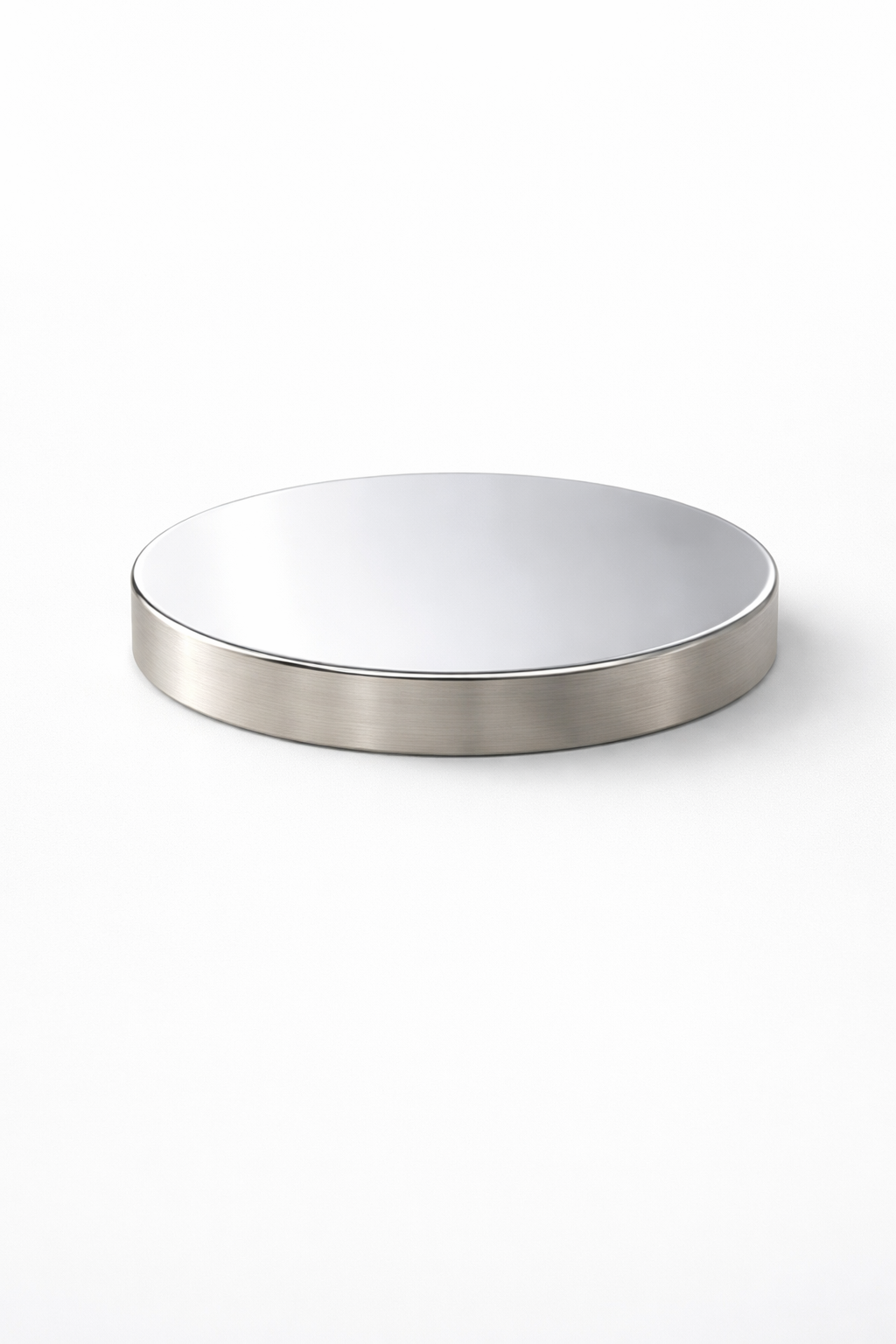 Round metallic lid for a candle jar on a white background