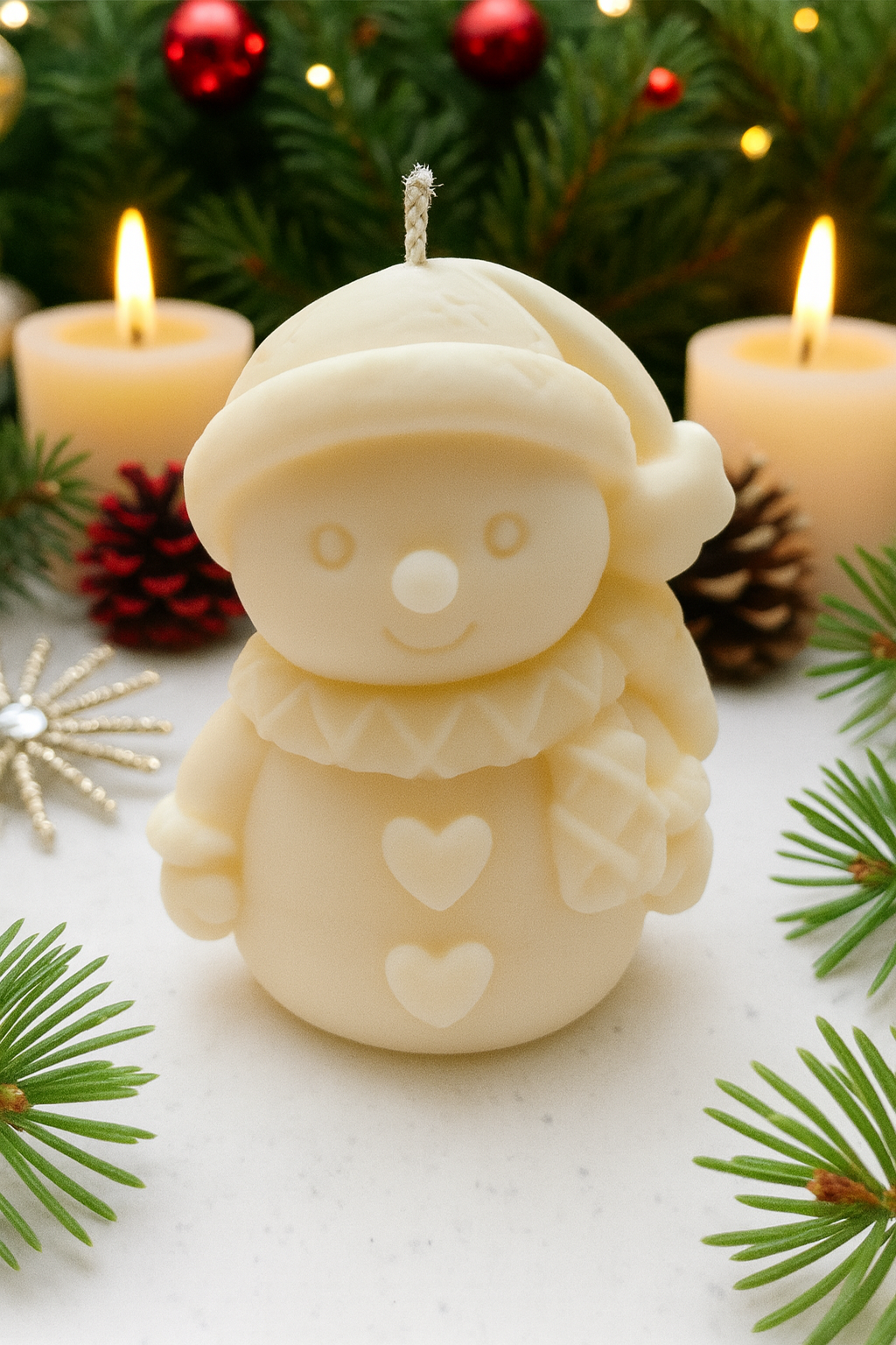 Snowman shaped candle with Christmas decorations in the background made from a Snowman Silicone Mold for candle making in Canada.